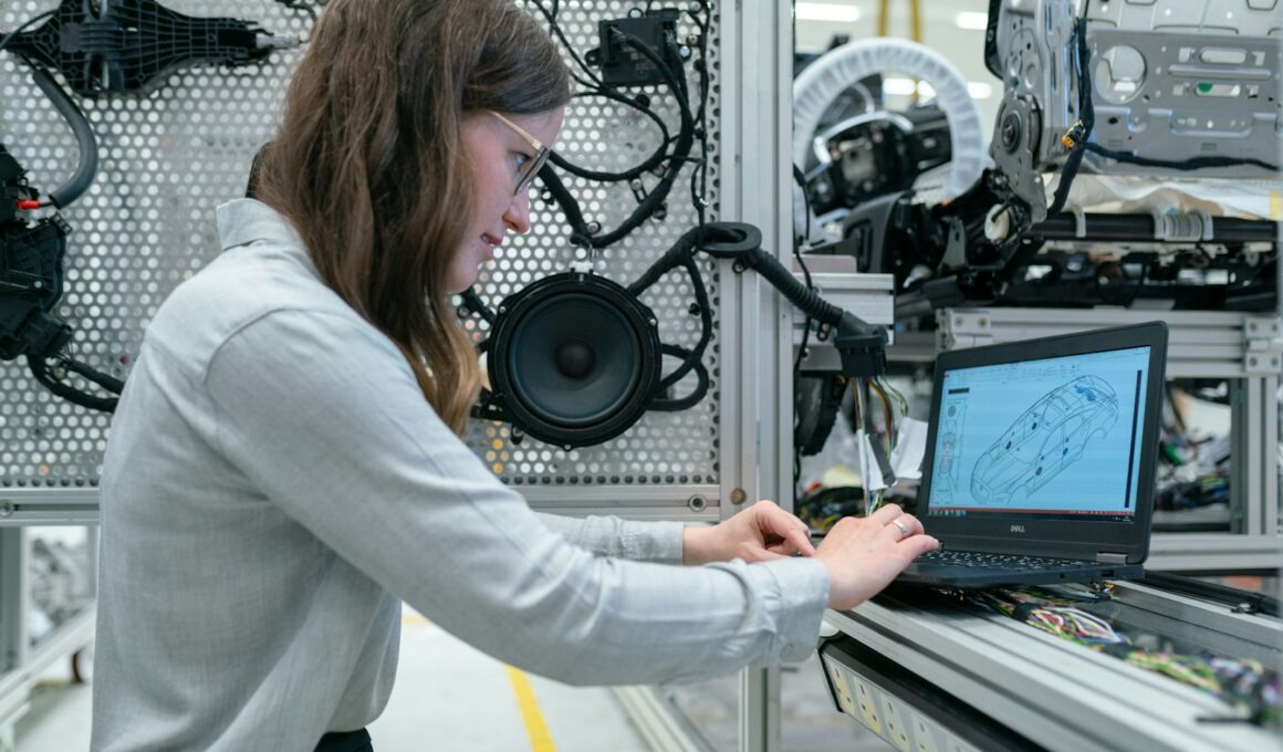 woman in white long sleeve shirt using black laptop computer